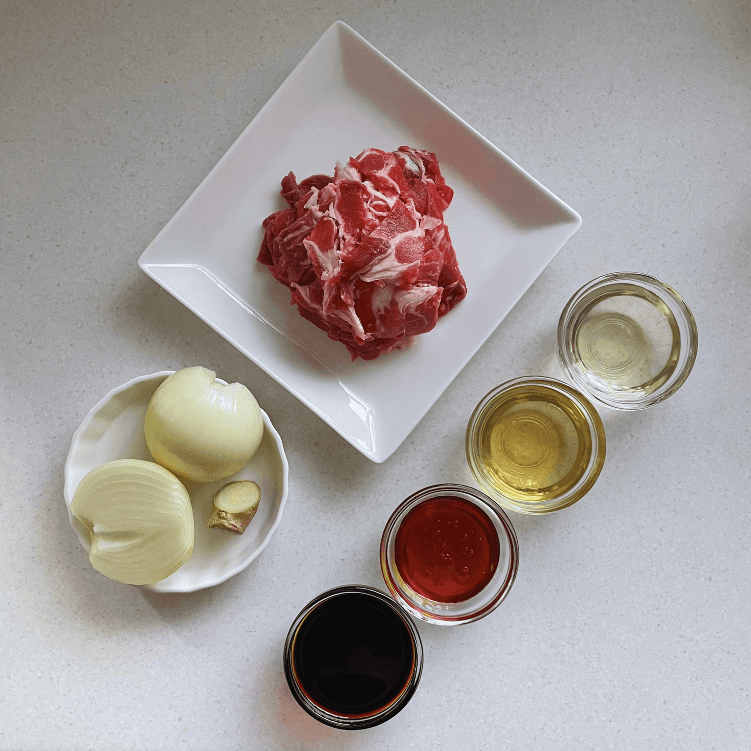 Thinly sliced beef, onion and rice ingredients for gyudon