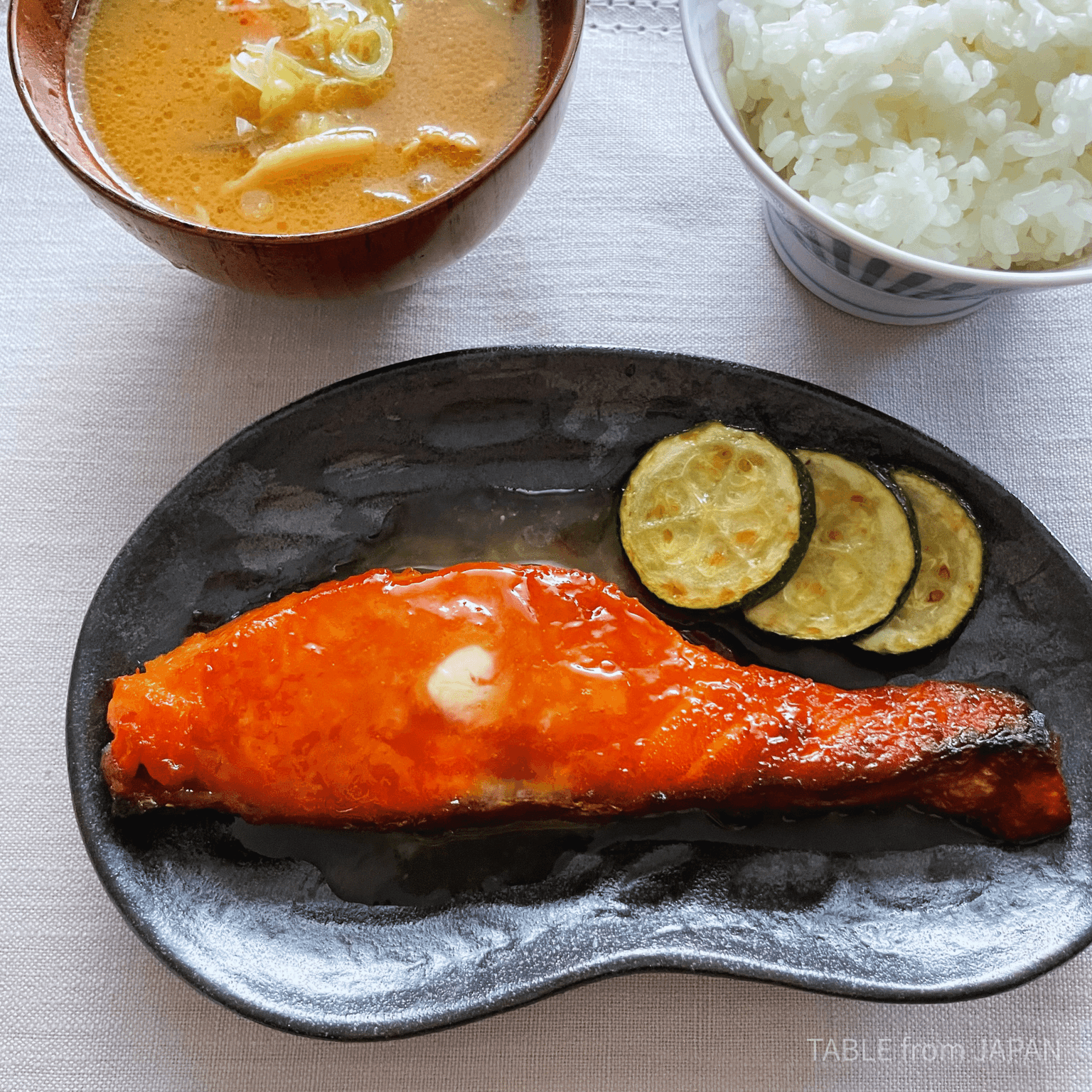 Finished miso salmon served with rice and vegetables
