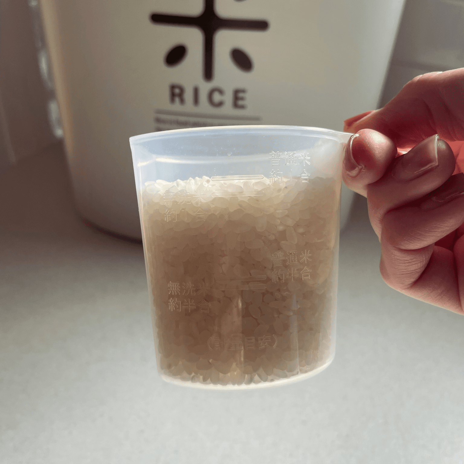 Measuring Japanese rice in a cup