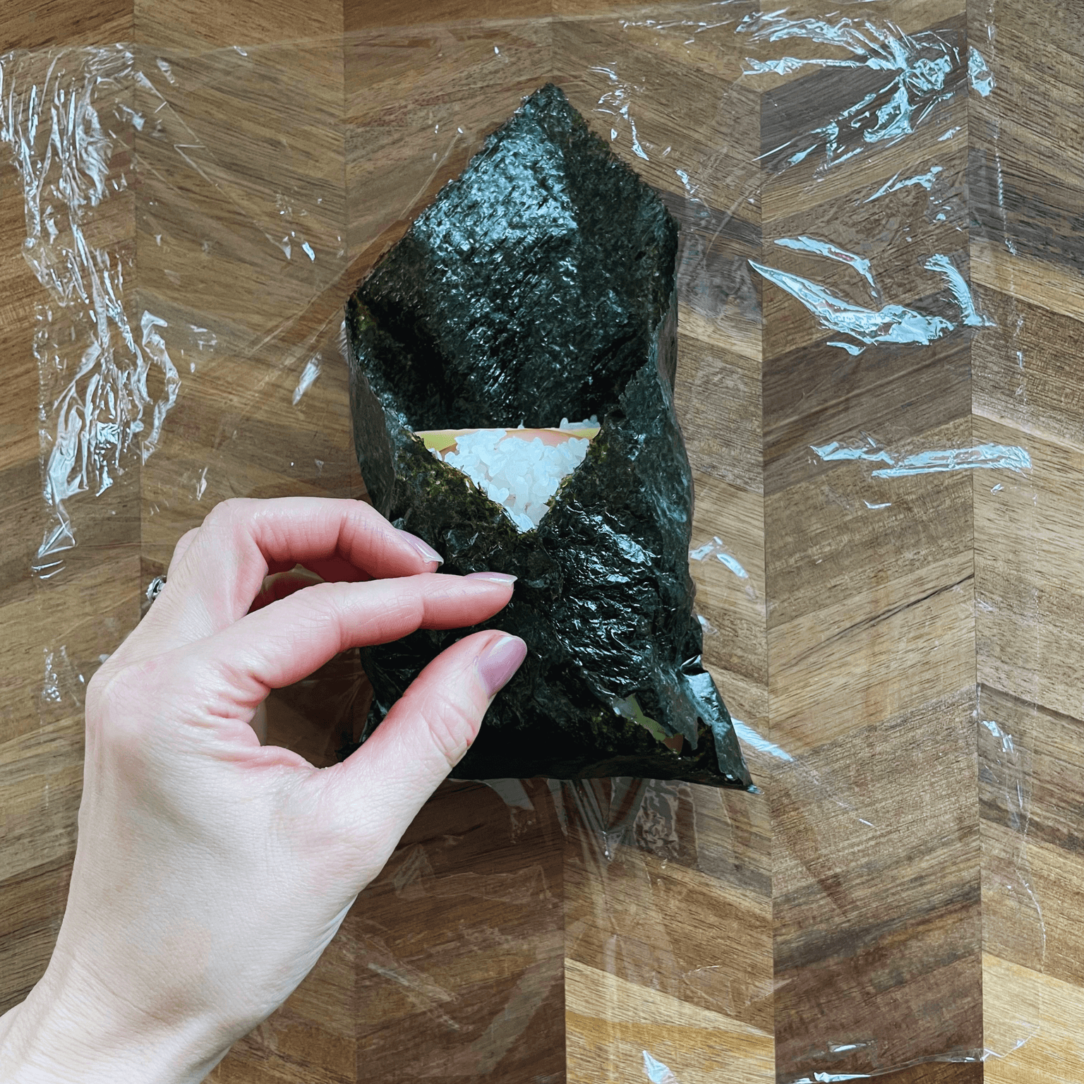 Onigirazu folded like a parcel before cutting