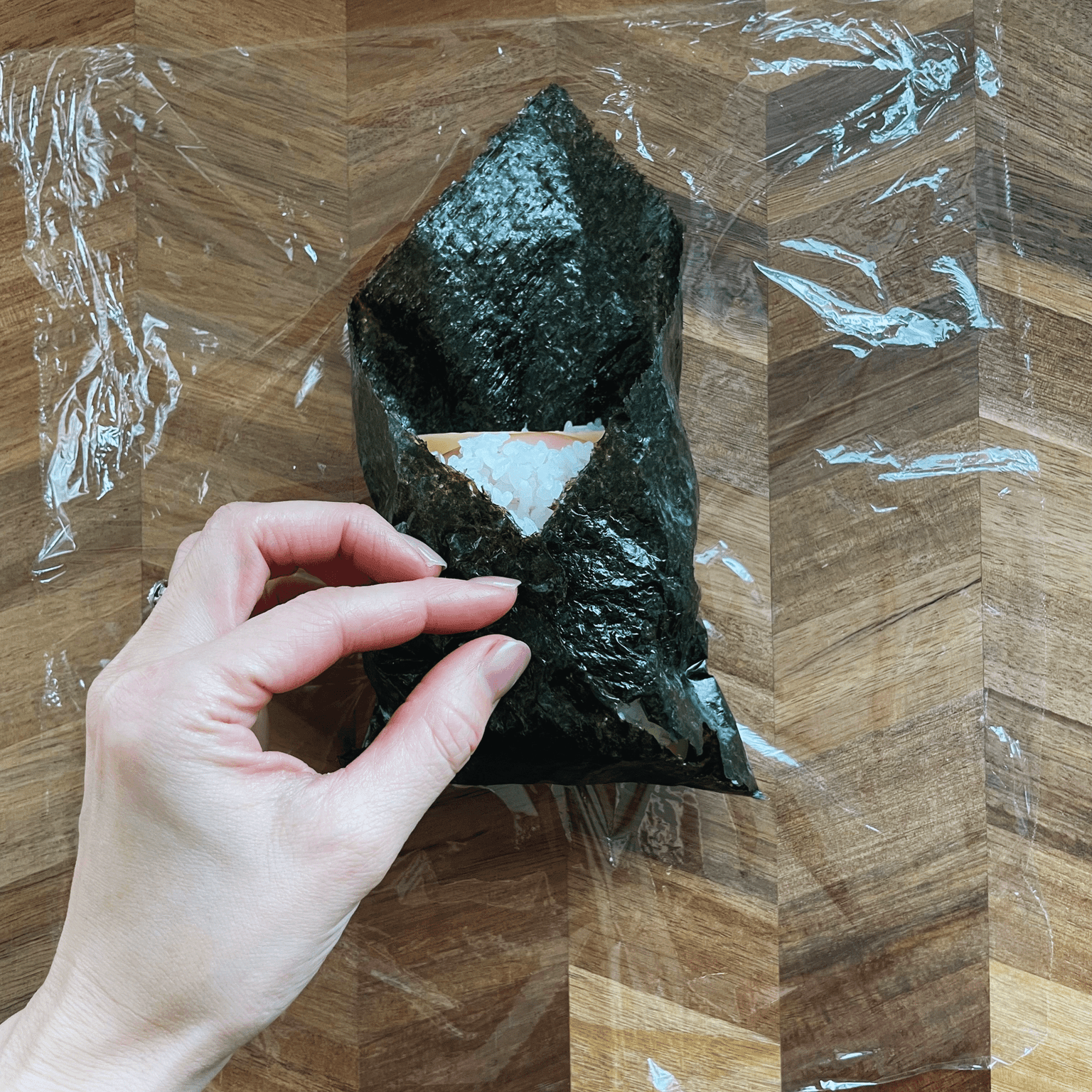 Onigirazu folded like a parcel before cutting