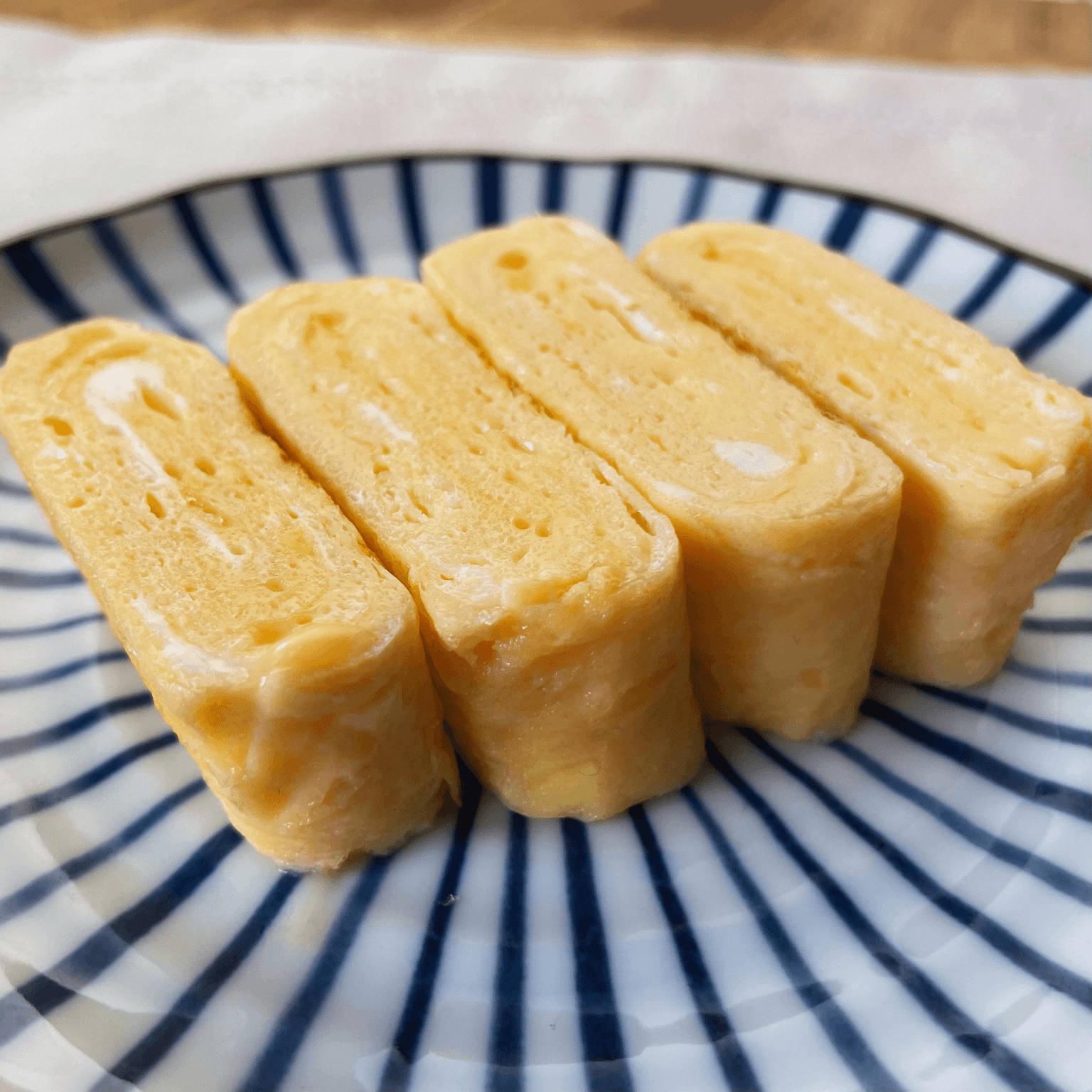 Tamagoyaki Japanese rolled egg sliced on a plate
